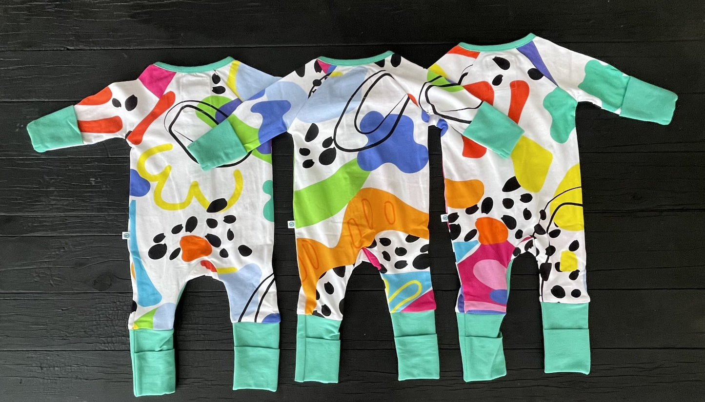 3x multi coloured long sleeve baby onesie with fold over hand and foot cuffs in unisex design