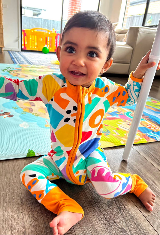 Sunsea Onesie with juicy tangerine trim