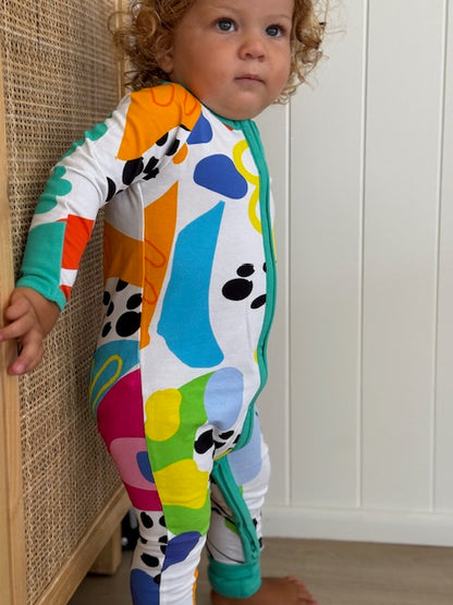 multi coloured long sleeve baby onesie with fold over hand and foot cuffs in unisex design