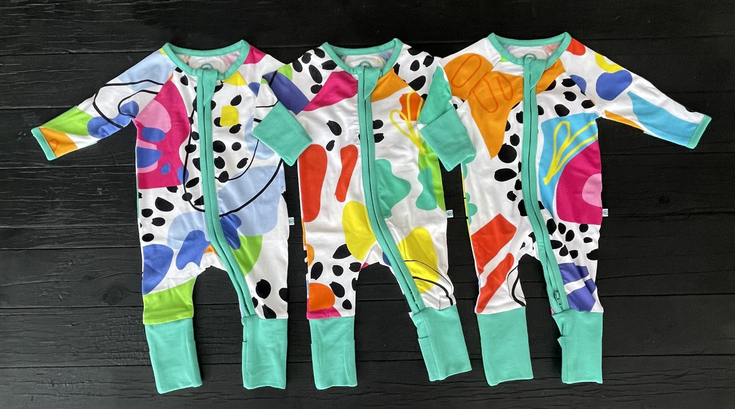3 x multi coloured long sleeve baby onesies with fold over hand and foot cuffs in unisex design
