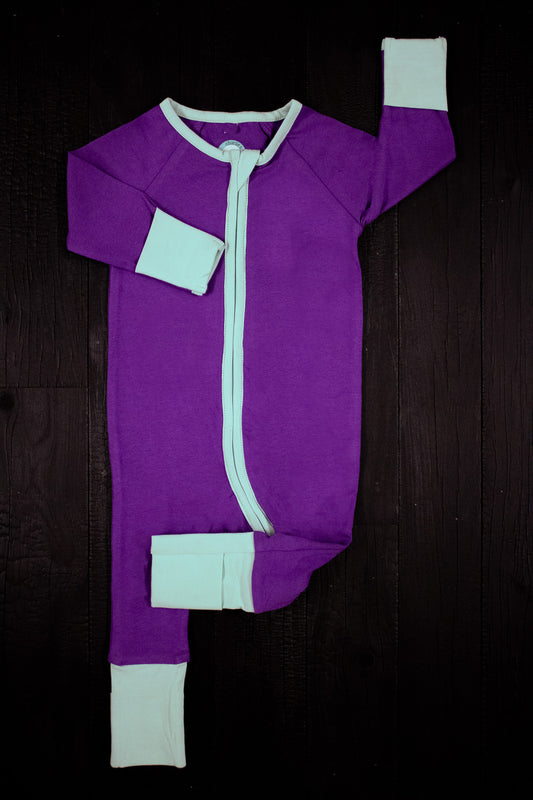 solid purple long sleeve baby onesie with teal trim with fold over hand & foot cuffs and double zip